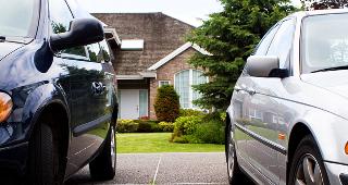 Two cars in driveway © debr22pics/Shutterstock.com