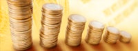 Stacks of golden coins against golden dollar