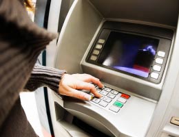 2010-checking-study-5-atm-lg Woman using the ATM