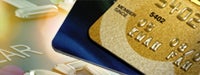 Credit card guide: Two credit cards in front of brighty-lit enlarged credit card