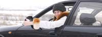 Happy man sitting in car