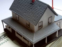 5-critical-items-any-budget-3-big-lg Miniature house on top of money bill