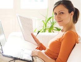 5-questions-before-renewing-cd-5-out-lg Woman working on laptop and paperwork