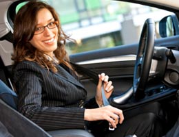 6-auto-insurance-potholes-1-intro-lg Woman buckling up her seat belt