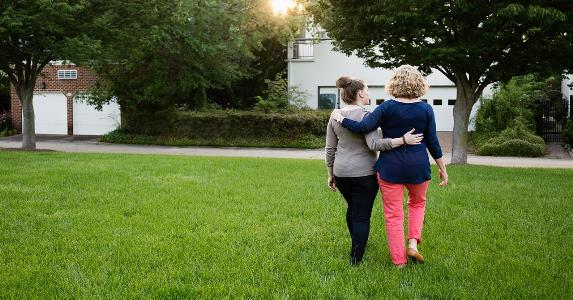 Mom and daughter walking | Roberto Westbrook/Getty Images