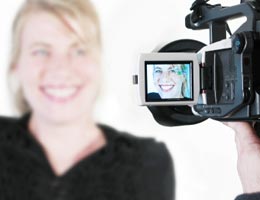 9-tips-refreshing-your-resume-10-video-lg Woman smiling to a video camera