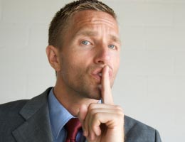 9-tips-refreshing-your-resume-9-confidentiality-lg Man gesturing to be quiet, ssshh