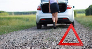Woman on roadside © FotoYakov/Shutterstock.com