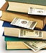 stack of books with money in each