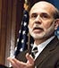 Ben Bernanke brown background flag © Albert H. Teich/Shutterstock.com