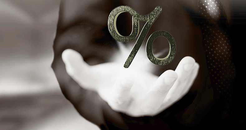 What will it take for ARMs to make a comeback? Businessman holding shining percentage sign, sepia tone © iStock
