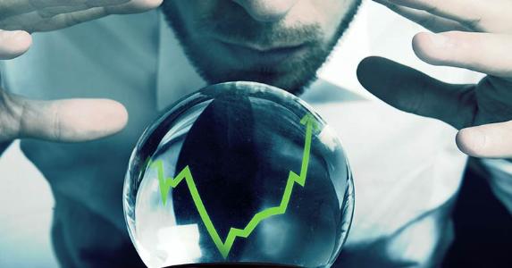 Businessman predicting rates with a crystal ball © aphaspirit/Shutterstock.com