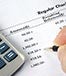 Calculator checking account statement © JohnKwan/Shutterstock.com