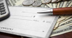 Calculator with white checks, wood pen and money
