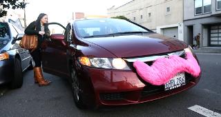 Lyft car with pink mustache © Jeff Chiu/Associated Press