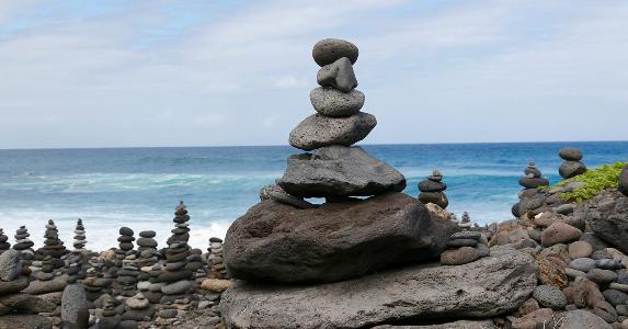 Building a CD ladder can elevate your returns Rocks balancing on each other on the beach | Andreas Naumann / EyeEm/Getty Images