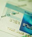 Clear credit card laying on bill or statement