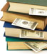 Books stacked with money inside