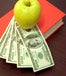 orange book with money and an apple on top