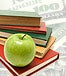 stack of books, a green apple and money