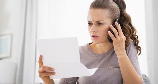 Concerned woman on phone © Alliance/Shutterstock.com