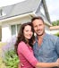 couple embracing in front of home