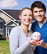 Couple holding piggy bank