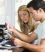 couple reviewing bills at computer