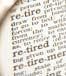 Magnifying glass on words "Retire" in dictionary
