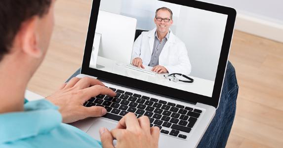 Doctor on laptop display © Andrey_Popov/Shutterstock.com
