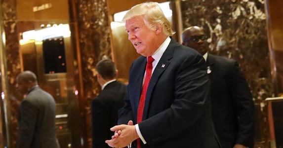 Will Trump help or hurt your finances? See Americans say Donald Trump in lobby with security | Spencer Platt/Getty Images