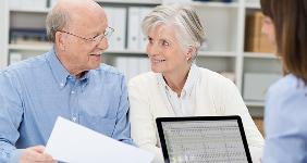 Elderly couple with adviser