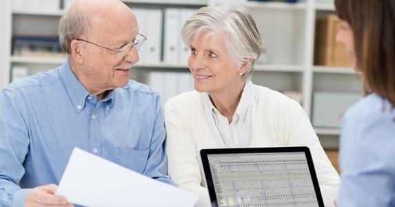 Elderly couple with adviser