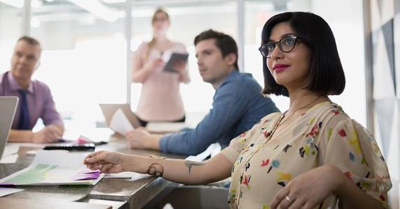 Bankrate survey: Half of Americans haven't had a raise in a year Employees in conference meeting | Zach Gibson/Getty Images
