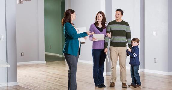 Family at an open house showing © iStock