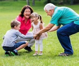 Grandparents playing with kids outside | Andrey_Popov/Shutterstock.com
