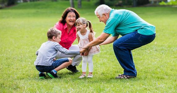 Grandparents playing with kids outside | Andrey_Popov/Shutterstock.com