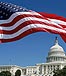 American flag flying over the capitol building