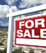 for sale sign over town