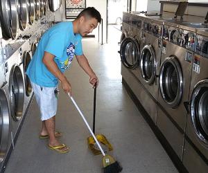 Frank Ahn sweeping laundromat | Photo courtesy of Frank Ahn