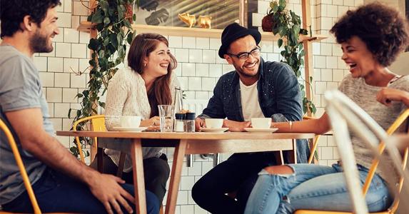 Money market mutual funds Friends laughing at lunch © Jacob Lund/Shutterstock.com