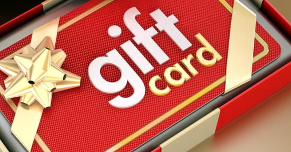 Gift card with gold bow in a box © iStock