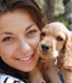 Girl holding her puppy