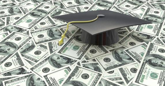How best to handle $250K in student loans? Graduation cap on $100 bills © iStock
