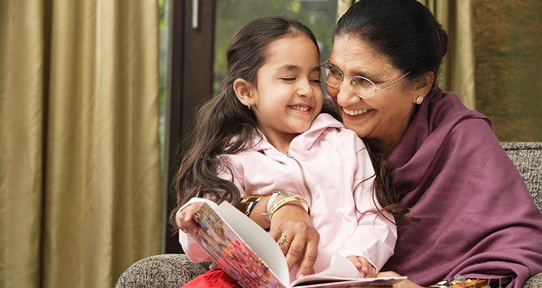 Mortgage rates headed higher. Lock your rate now Grandmother reading to child | Asia Images Group/Shutterstock.com