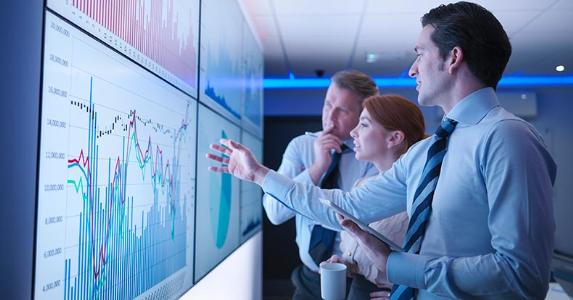 What the debt-to-equity ratio tells investors Group of analysts discussing graphs on multiple screens | Monty Rakusen/Cultura/Getty Images