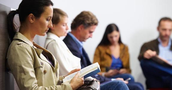Americans willing to wait for their tax refunds People sitting in a waiting room | Ghislain & Marie David de Lossy/Cultura/Getty Images