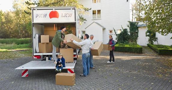 Moved recently? You may be due for a tax deduction Group taking boxes off of the moving truck | Westend61/Getty Images