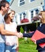 Couple shaking hands with real estate agent