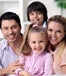 happy family of four in home